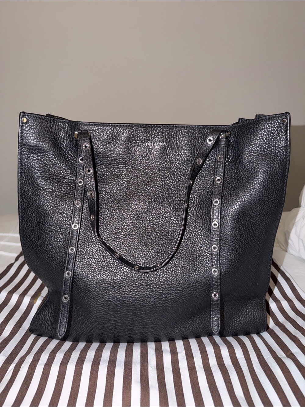 Henri Bendel Cooper leather grommet tote